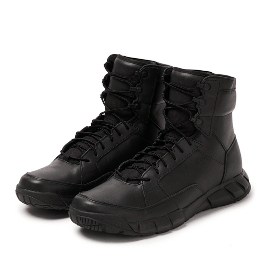 Pair of black Oakley boots on a white background